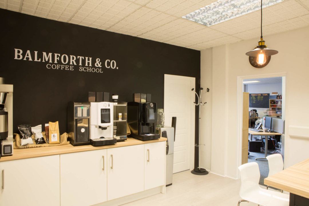 Barnsley office space used as a coffee school, countertops filled with coffee machines and ingredients